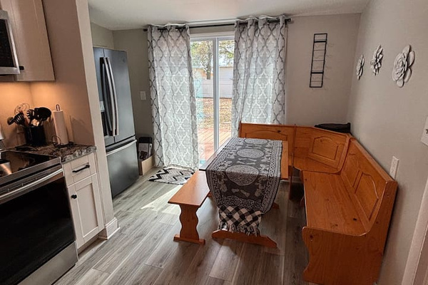 Sliding Glass door leads to outside patio and fenced yard.