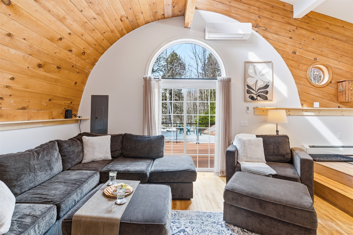 The ultimate 'sink-in' sectional: your front-row seat to the warmth of the fire and the glow of the Bethel woods.