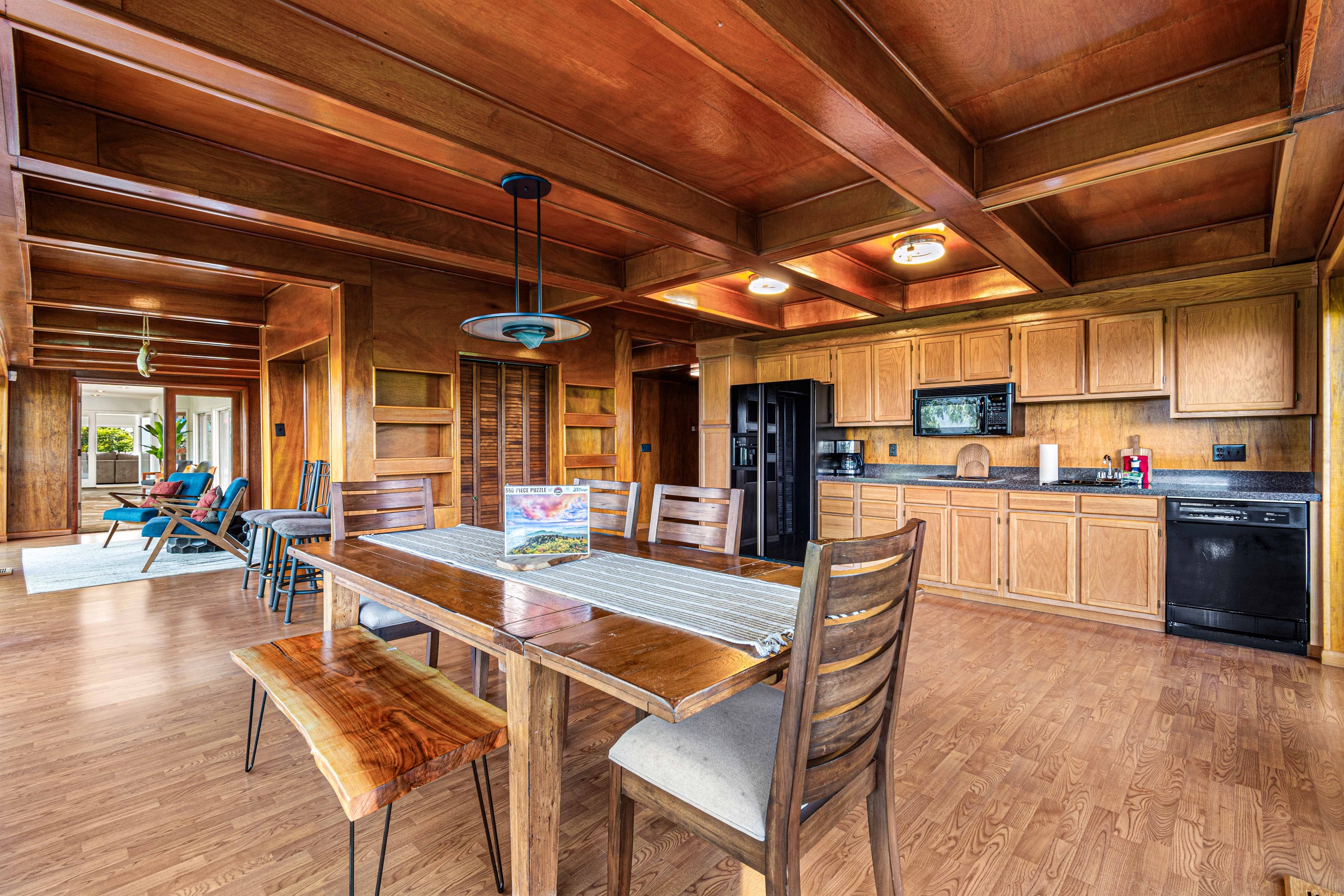 Dining Room: Enjoy meals surrounded by stunning wood accents and a vibrant, airy atmosphere!