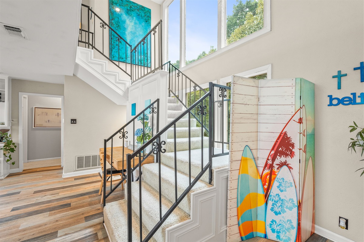 The great room leads upstairs, as well as to the downstairs chill zone.