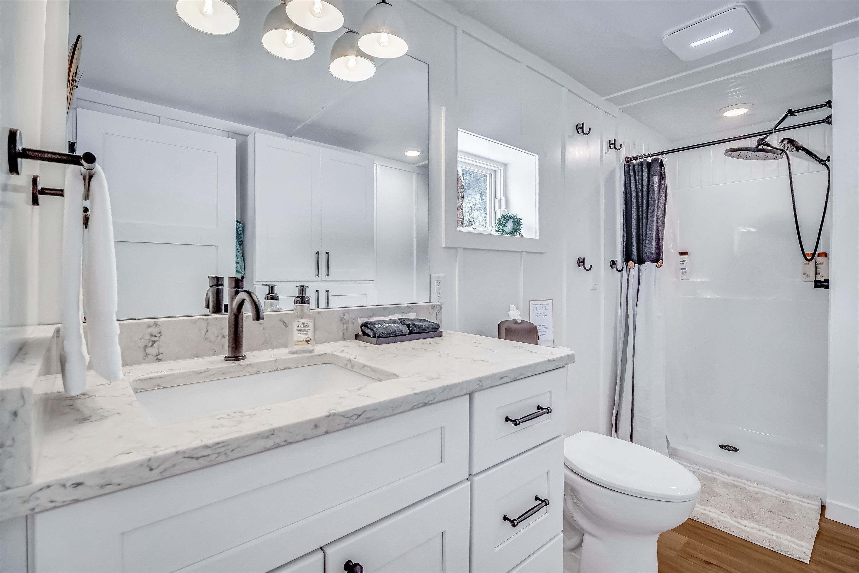 Full bathroom includes soap, shampoo, conditioner, body wash, towels, hand soap, toilet paper, hair dryer
