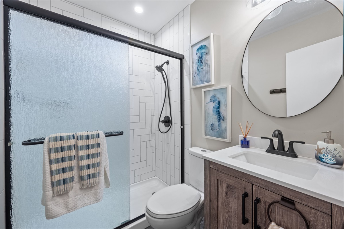 Fresh, modern bathroom with walk-in shower and coastal-inspired details