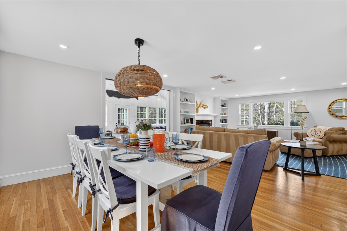 Gather around our cozy dining table for 8, open to the living room!