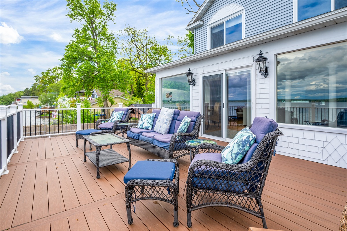 Comfortable outdoor lounge setup overlooking the lake—your perfect gathering spot under the sky.