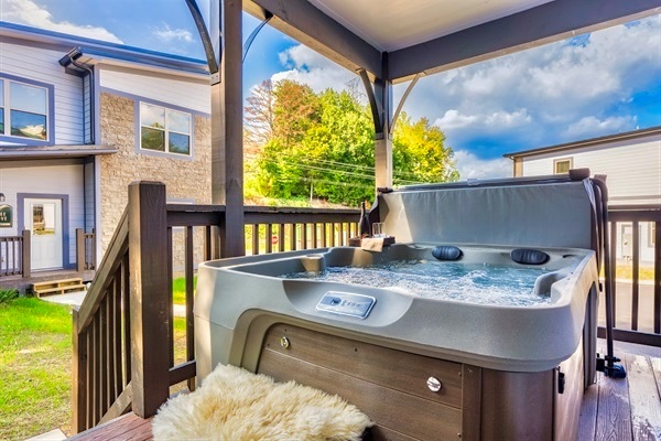 Unwind in the private hot tub under a starlit sky for the ultimate relaxation experience.