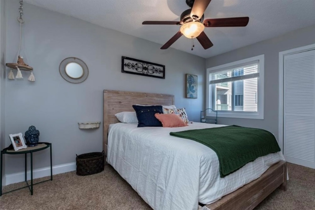 Queen sized bed with closet. Ceiling fans in all bedrooms for comfort as the unit does not have A/C.