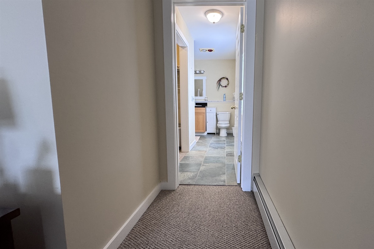 Hallway from the primary bedroom to the en suite