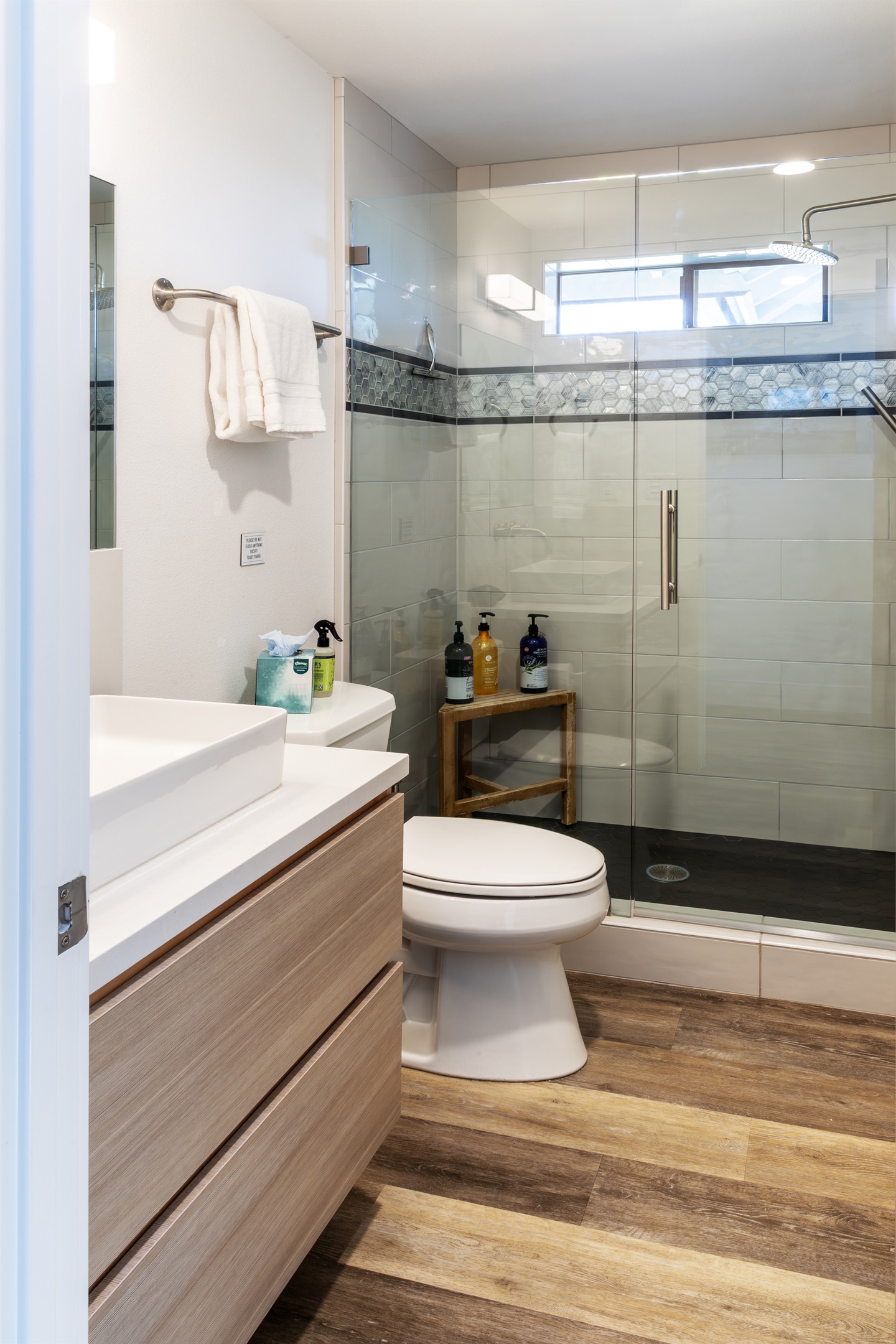 Clean lines, glass-enclosed walk-in shower, and thoughtful touches throughout. Relaxation starts here.