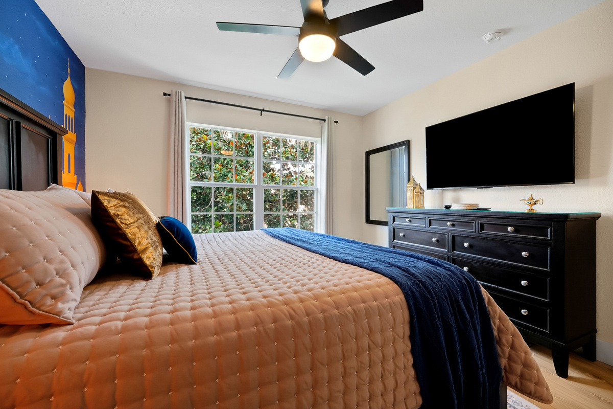 Aladdin King Suite: Spacious king bedroom with TV, ensuite and whimsical Aladdin-inspired details.