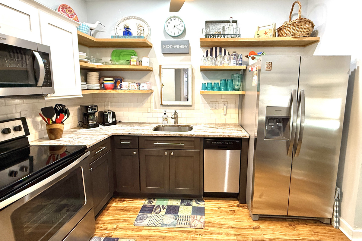 Provisions include coffee maker, electric kettle, toaster, crock pot, microwave, dishwasher