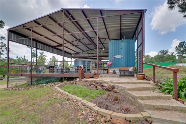 Two rustic containers under a large covered patio - perfect for outdoor enthusiasts.