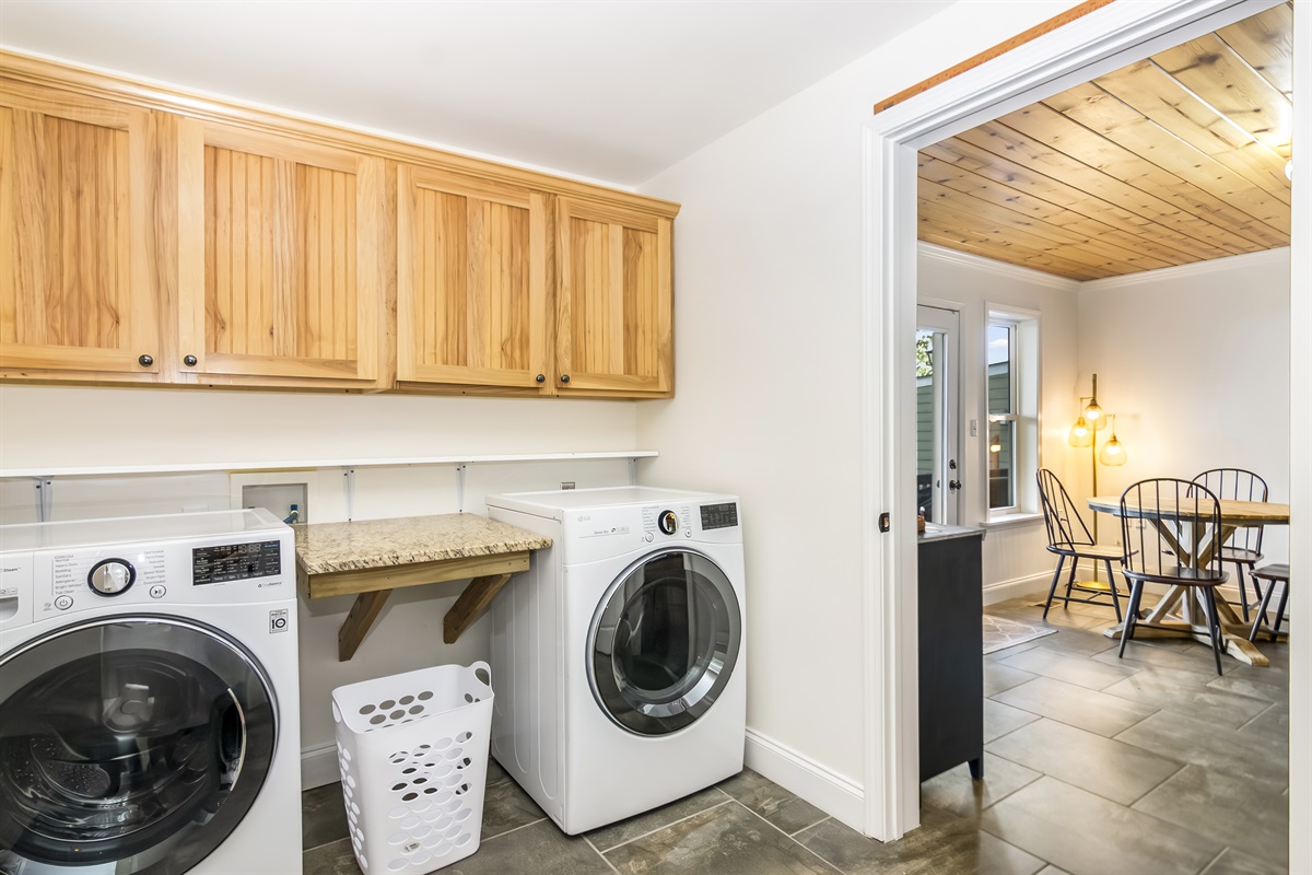 Laundry room next to kitchen