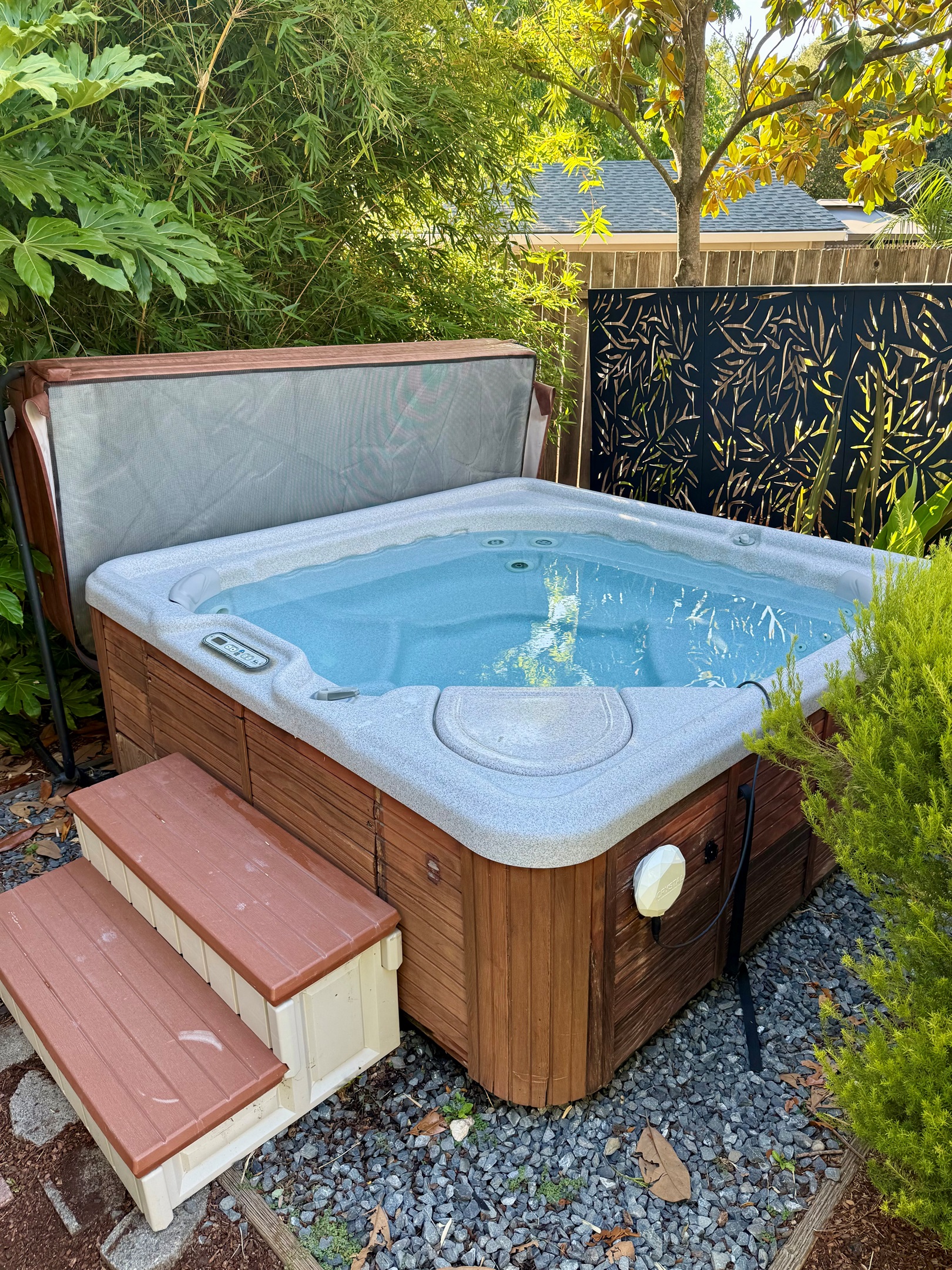 Warm hot tub deck ready for a relaxing soak under the open sky