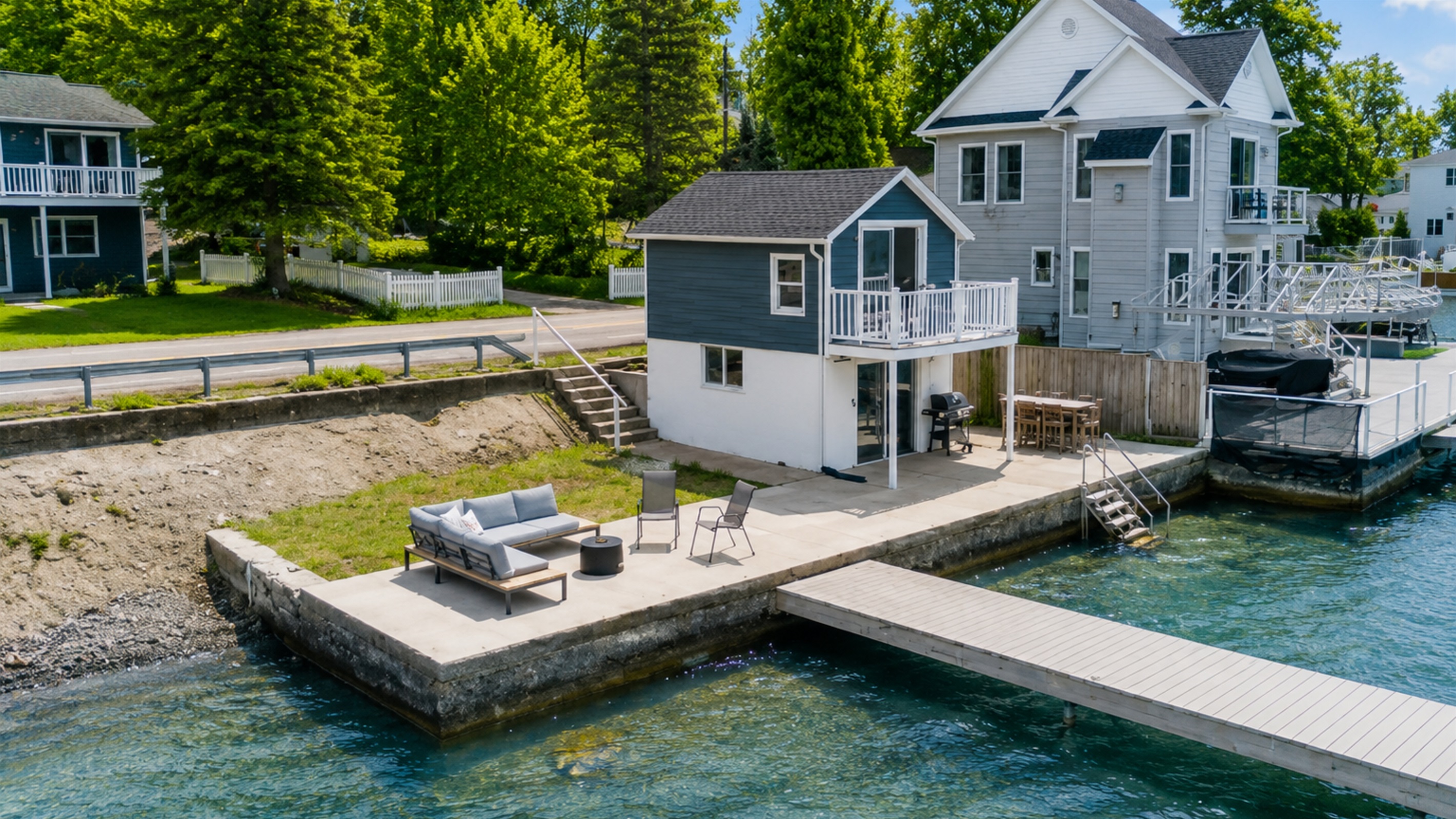 This charming lakeside cottage offers an unbeatable waterfront setting with a spacious patio, cozy fire pit, and your own dock—ideal for relaxing or entertaining. 🏡🔥🌊