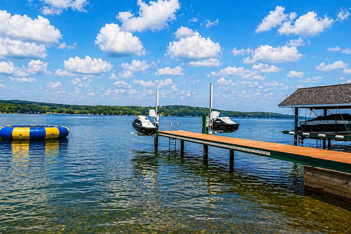 Expansive dock offering direct lake access for fishing, kayaking, and unforgettable sunsets.