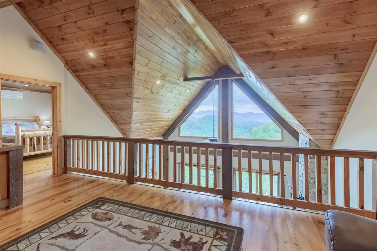 The large loft area has a bunk bed and receives lots of natural light, overlooking the living room with a great view.