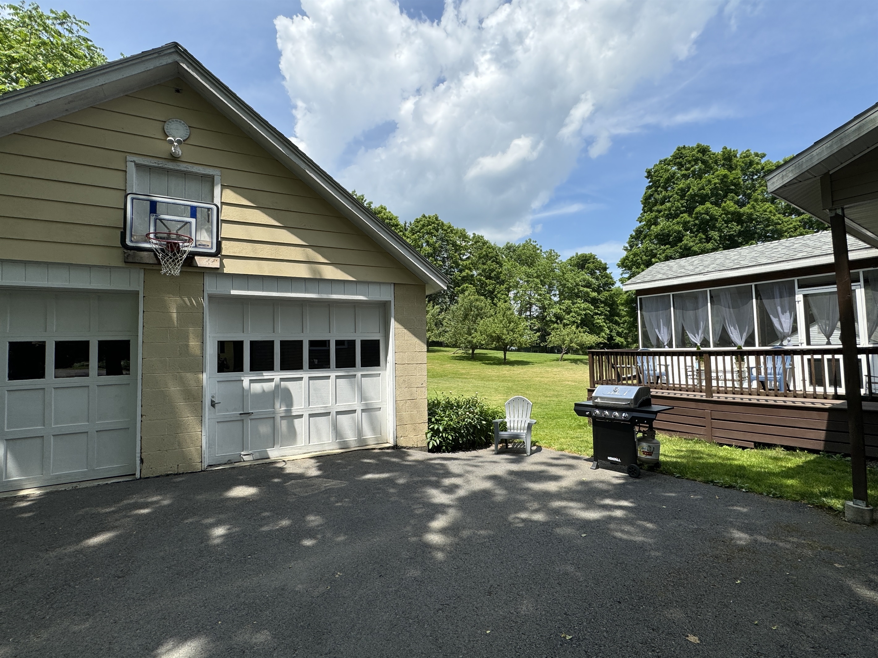 Basketball Hoop over garage makes for good outside fun.
