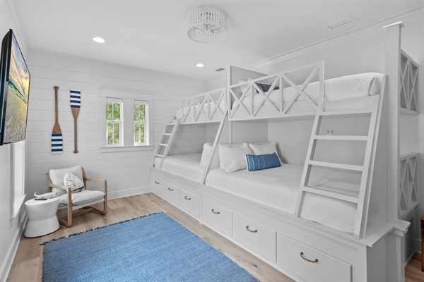 Spacious 2nd level twins over queens bunk room with full ensuite bathroom, tiled shower with tub, and a large vanity.