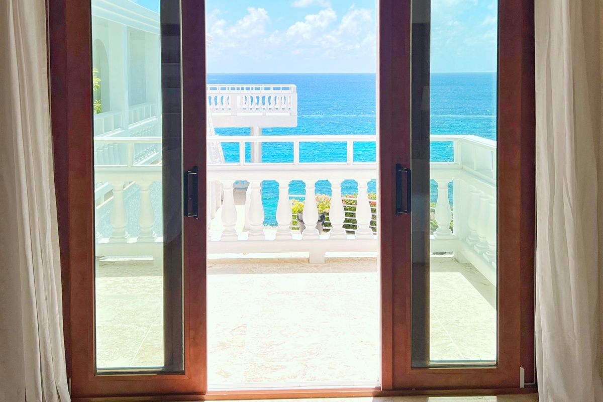 Wake to gentle waves from your private balcony retreat.