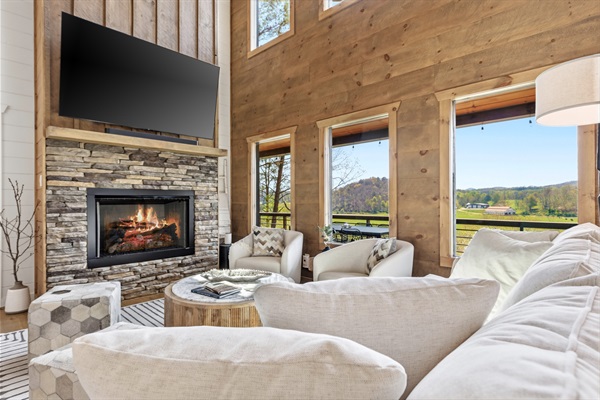 Relax on the deep, down-filled, couch while enjoying a breathtaking view of the mountains and pastures. The fireplace will keep you cozy and the 75" TV with immersive sound does not disappoint!