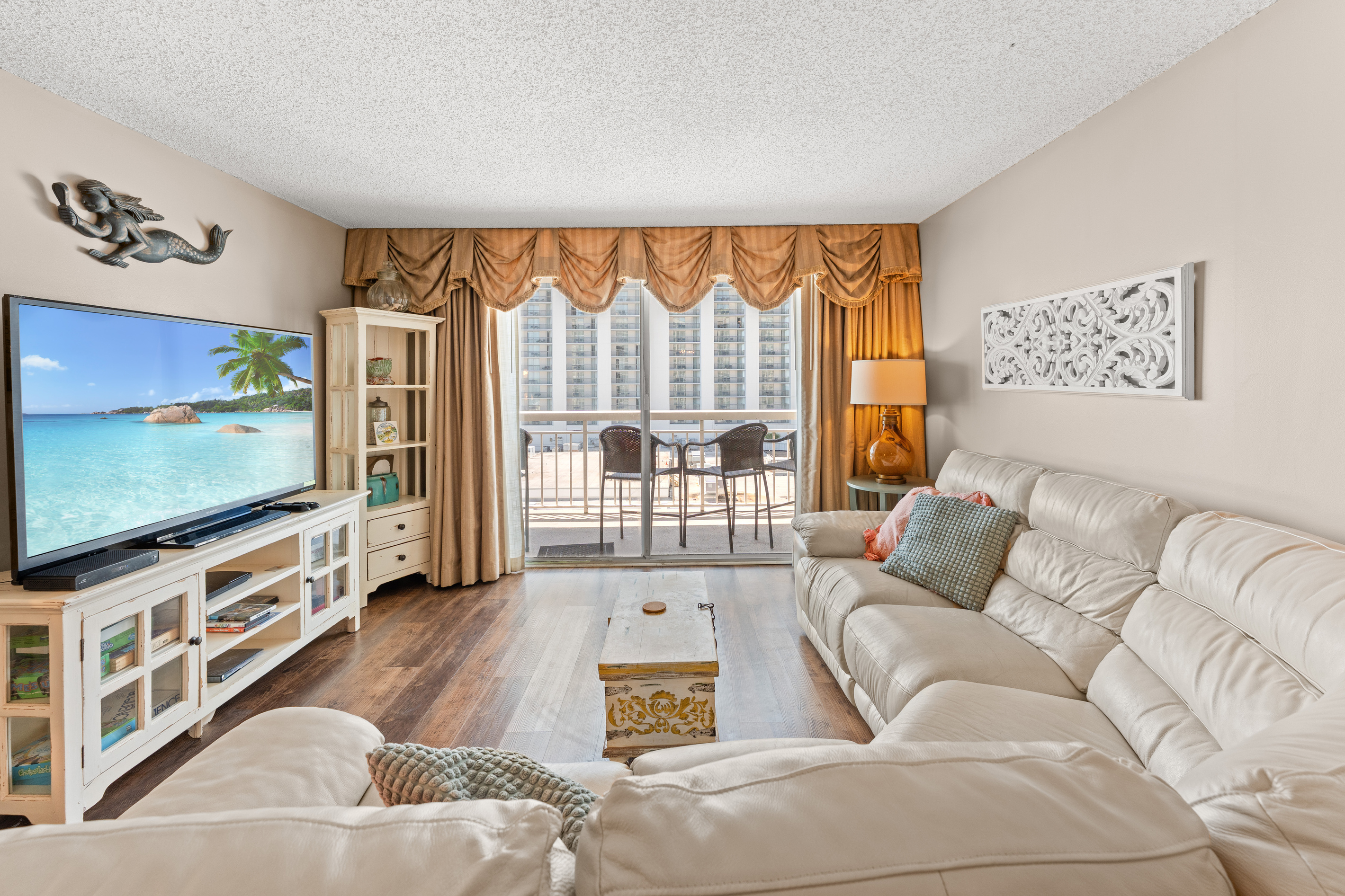 Huge Living Room with large TV and balcony access 