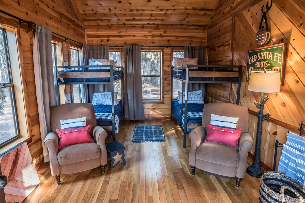 Kids and extra guests will love the sunroom with four twin beds.