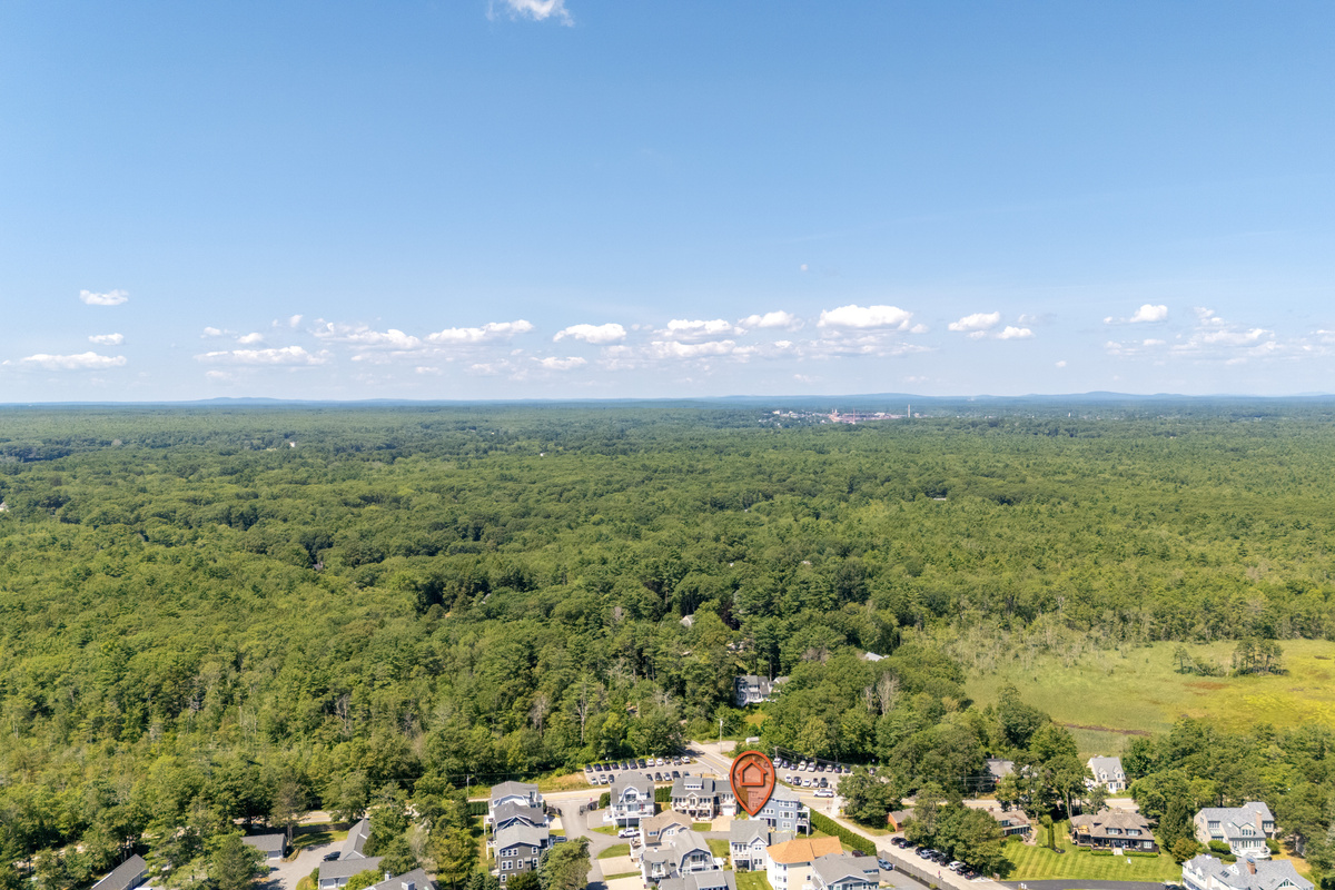 Surrounded by expansive greenery, this coastal community offers a peaceful setting near the shore.