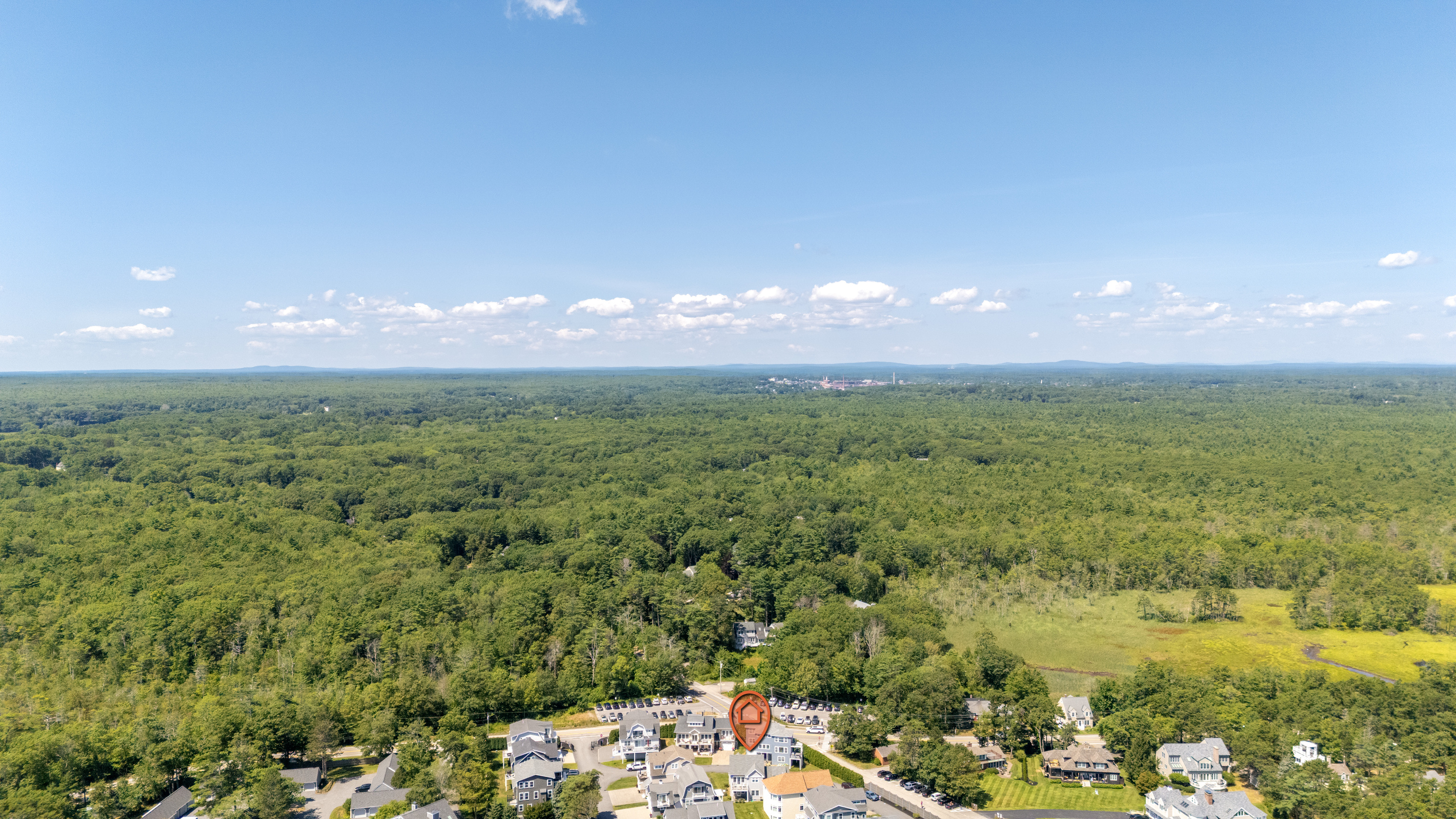 Surrounded by expansive greenery, this coastal community offers a peaceful setting near the shore.