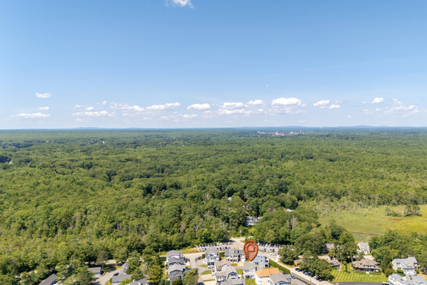 Surrounded by expansive greenery, this coastal community offers a peaceful setting near the shore.