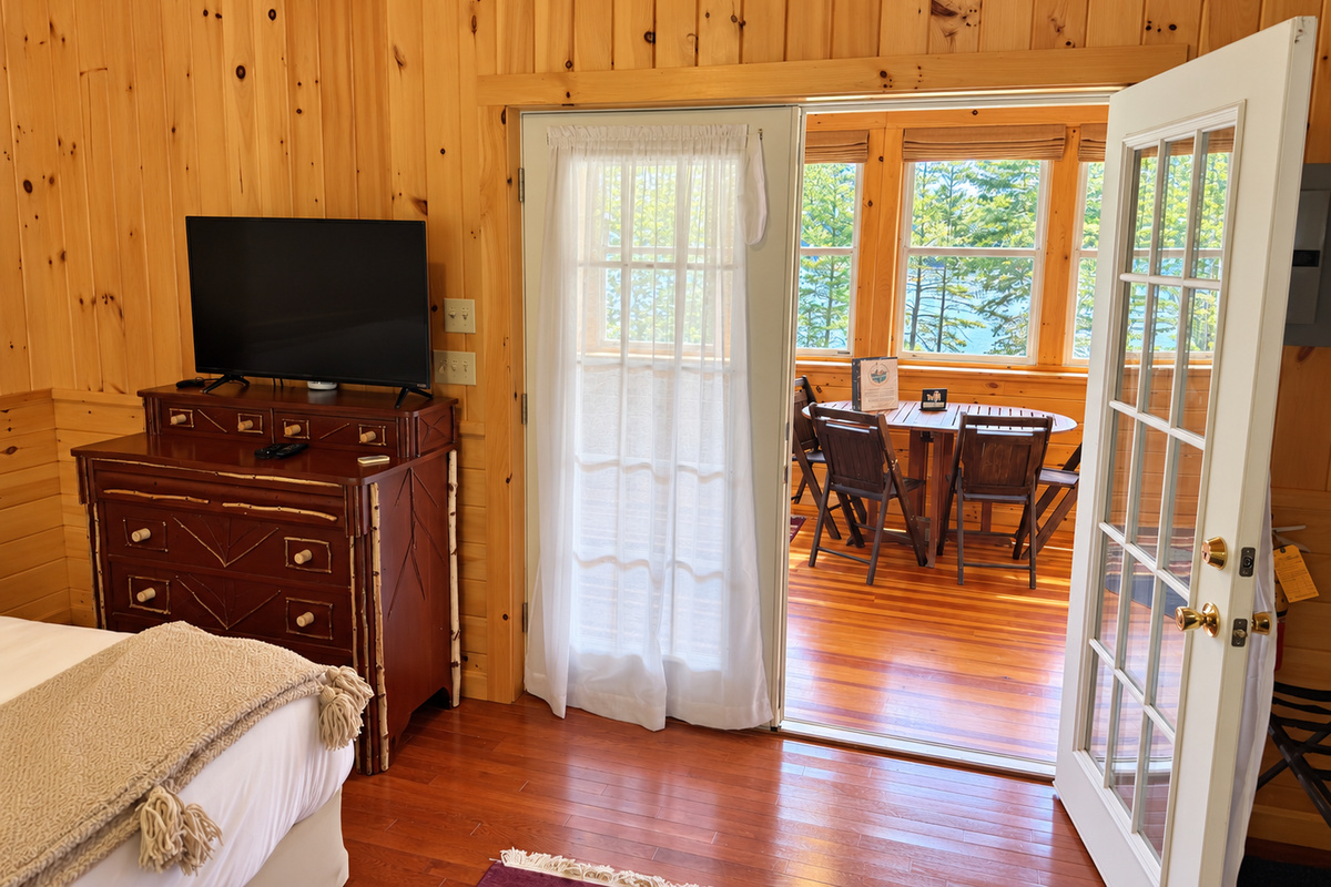 Queen bedroom with French doors to living room