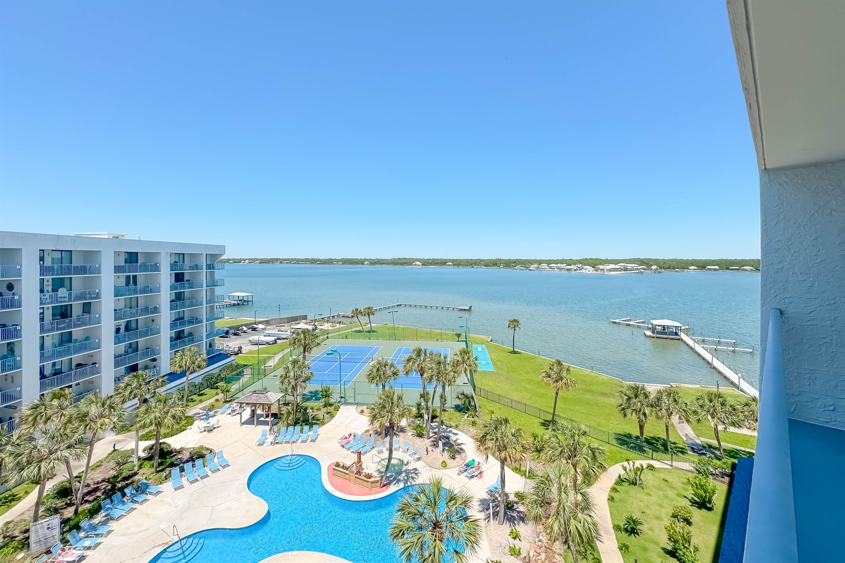 Resort-style living awaits. Enjoy our lush tropical courtyard featuring a sparkling pool, updated tennis and pickleball courts, and shuffleboard—all steps from the sand.