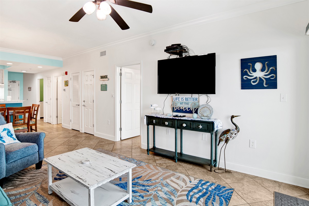 Living room sleeper sofa, 2 end tables, coffee table 2 arm chairs, ceiling fan and a 55" wall mounted Smart TV and a great direct Gulf view