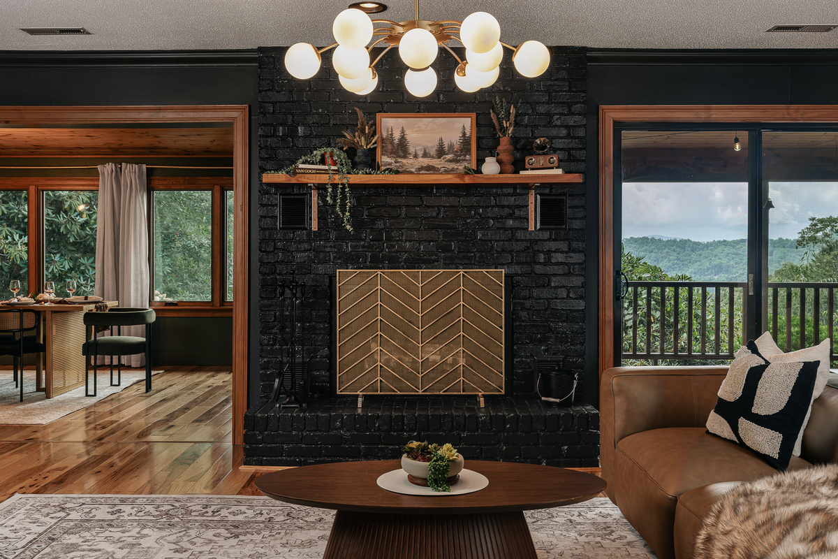 {Living Room} Gather around the statement fireplace with mountain views just beyond the glass and easy flow into the kitchen and dining spaces.