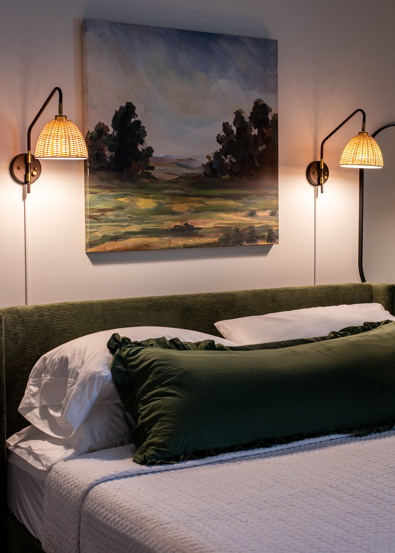 Painting matches the bed and pillow so well.