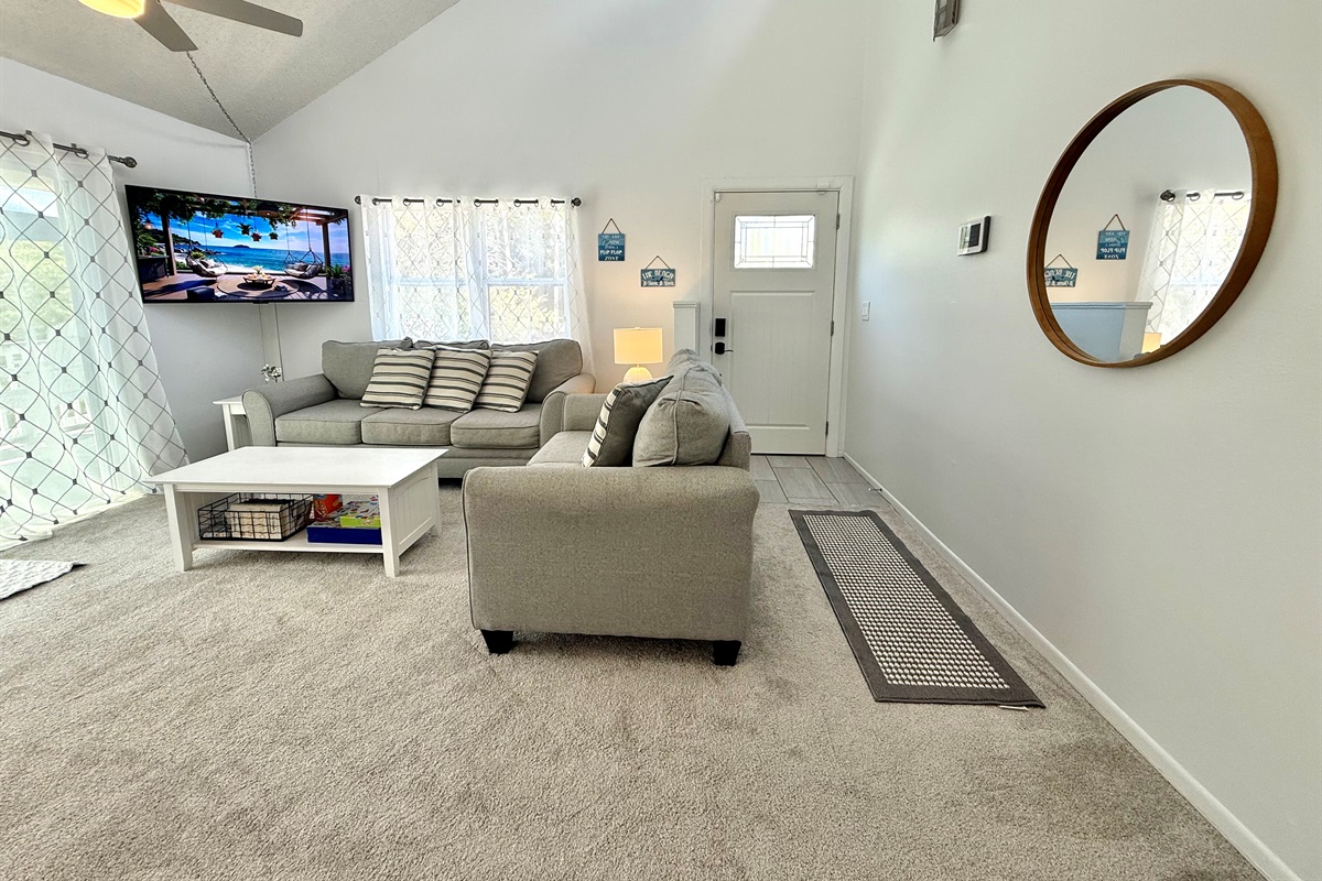 Seamlessly connected to the dining area, this open-concept living room is perfect for family gatherings, movie nights, or game nights.
