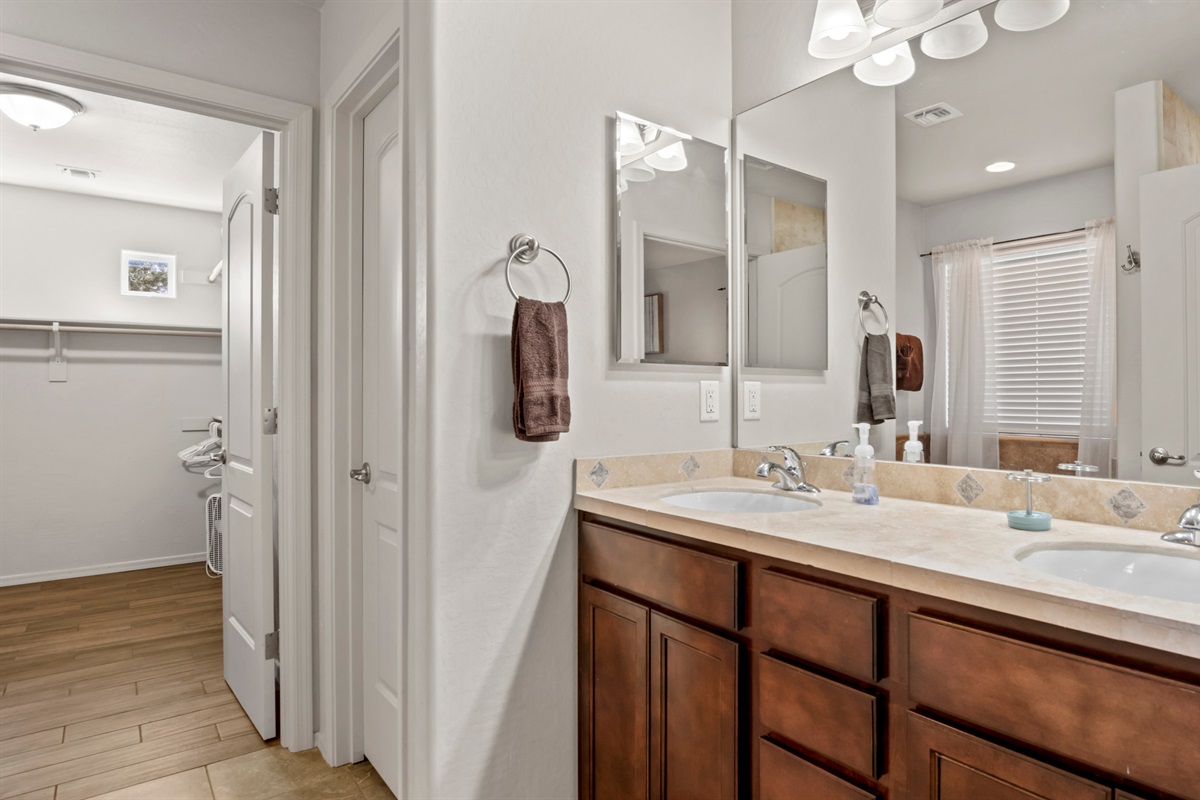 Enjoy the convenience of a spacious double vanity and a walk-in closet, making your master suite a perfect blend of style and functionality.