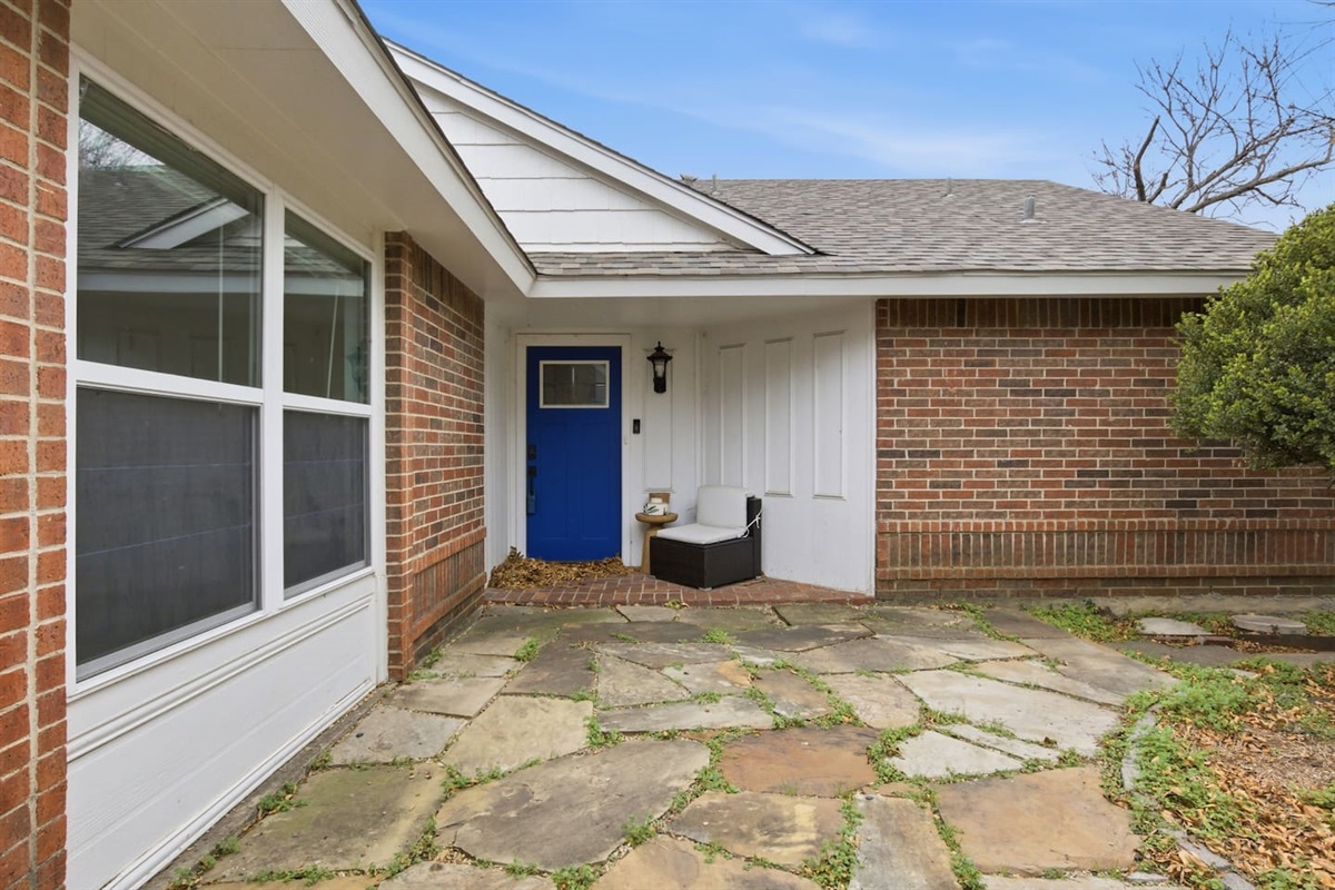 Private front entry with walkway access and welcoming curb appeal.