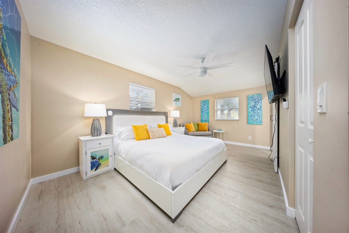 Primary bedroom with king bed and ensuite bathroom