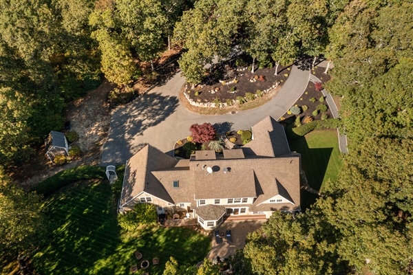 A full layout of lakeside living—grill, firepit, seating, and the water just steps away.