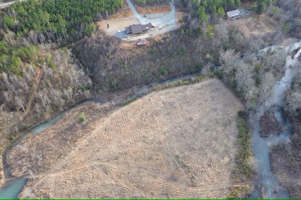 A winter bird’s-eye view reveals the river gently encircling the island below the cabin.