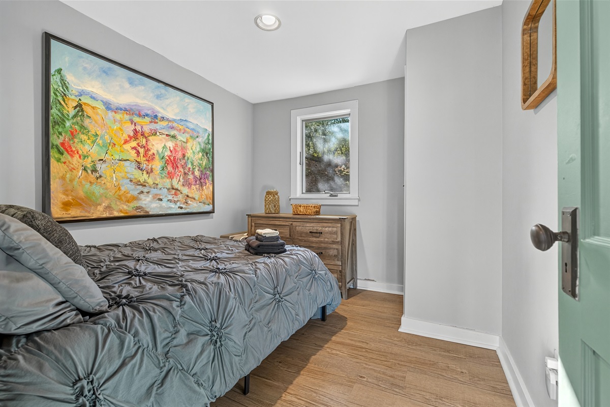 Bedroom 2 on the first floor of the home with double bed and tons of natural light
