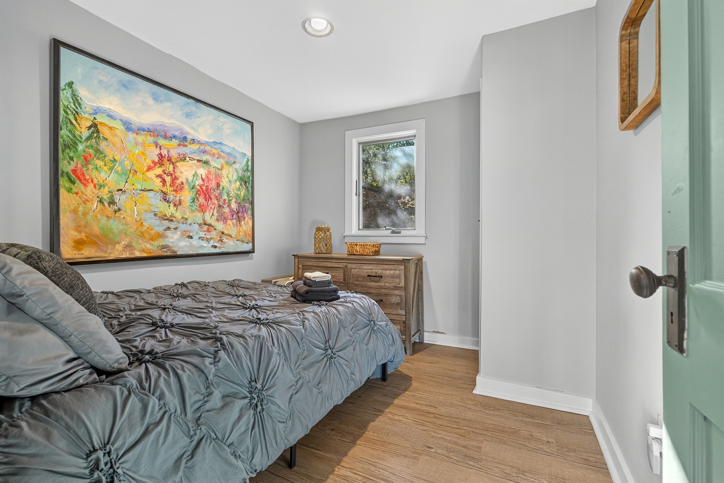 Bedroom 2 on the first floor of the home with double bed and tons of natural light