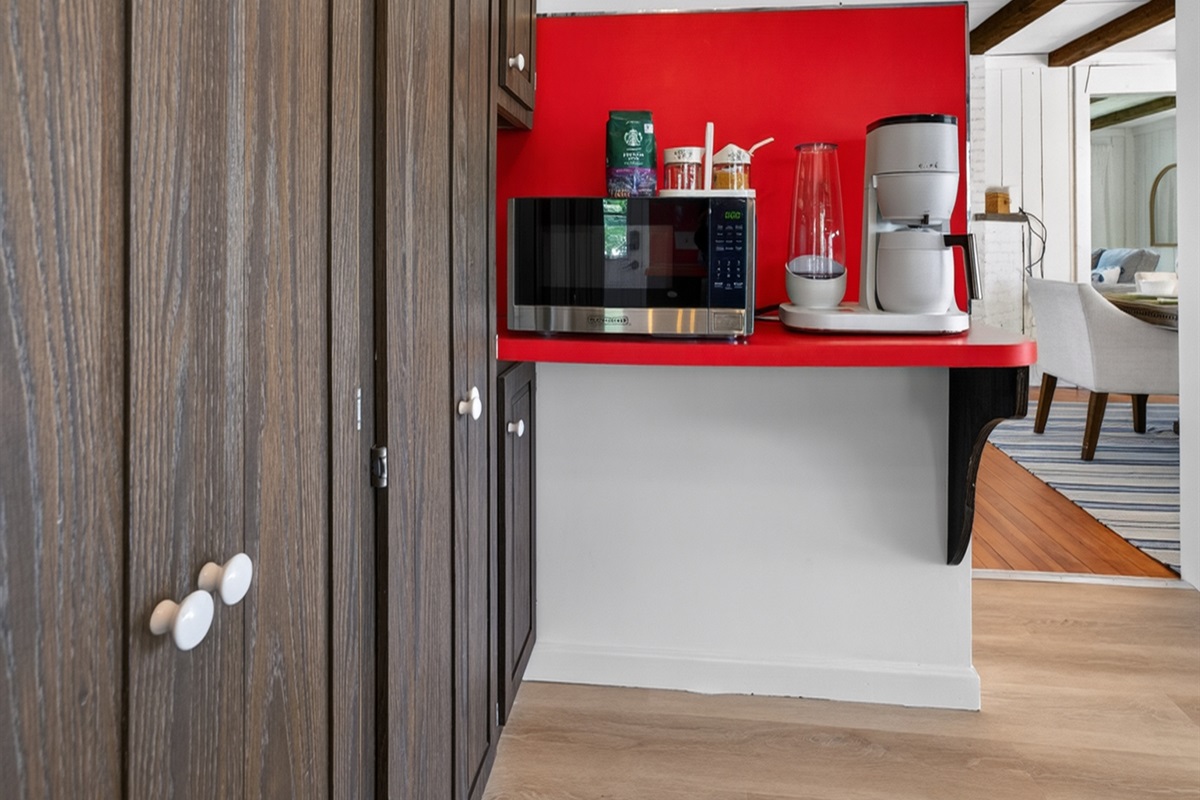 Functional kitchen space with sleek appliances, offering everything needed for a relaxed and convenient stay.