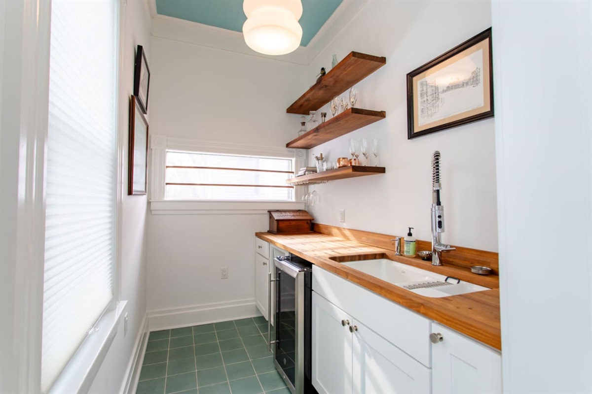 A spacious kitchenette with ample counter space, modern appliances, and plenty of storage, offering everything needed for cooking and meal prep in a compact yet functional setting.