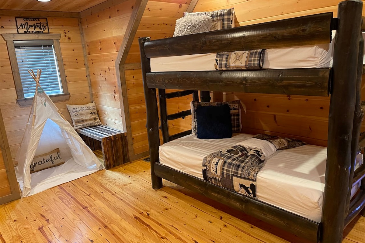 The gameroom is complete with XL bunk beds and a TEEPEE!!This space is upstairs adjacent to the 2nd Master bedroom. It is officially the game room, but has four walls with an oversized bunk bed that sleeps just like a 3rd bedroom.