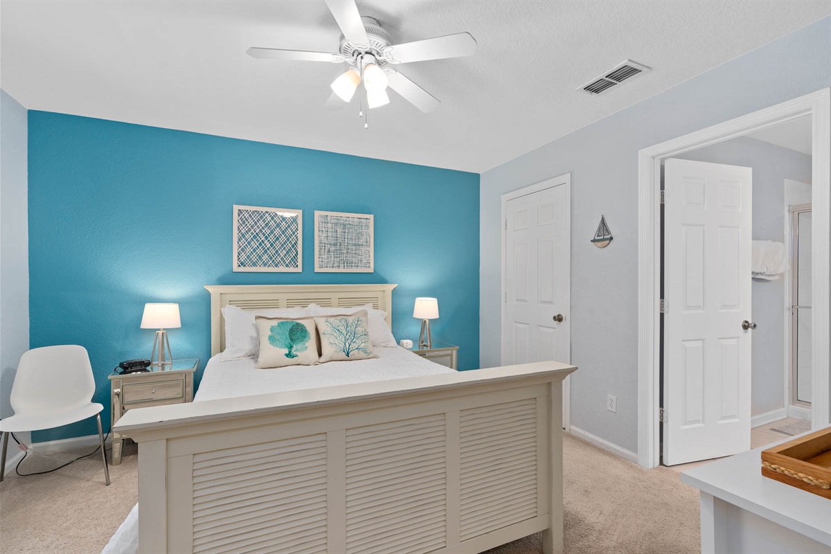 Upstairs queen ensuite with 55" TV - Now with luxury vinyl flooring!