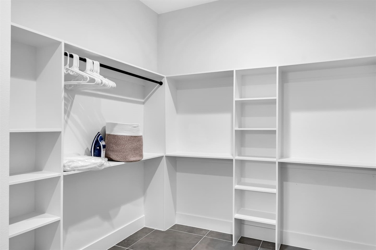 Ample storage with a full walk-in closet and hangers ready for extended stays.