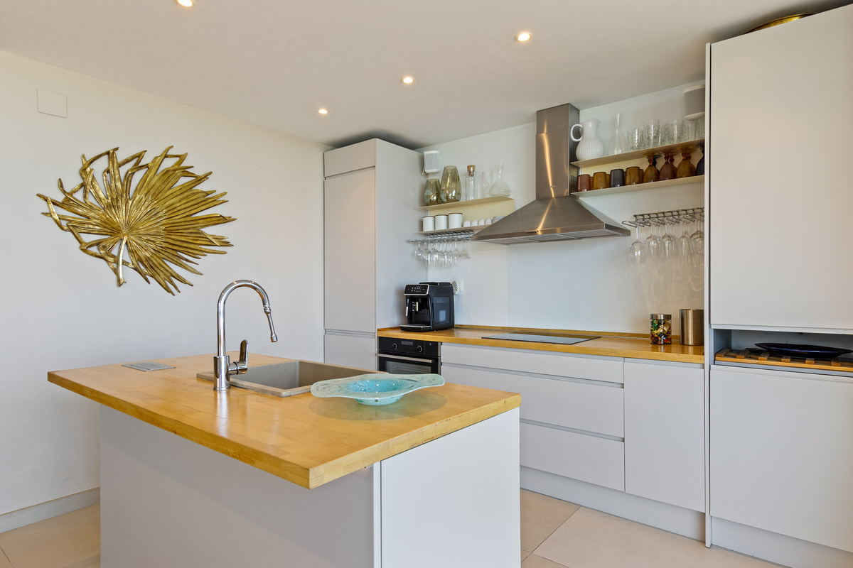Modern kitchen with island and fully equipped cooking space