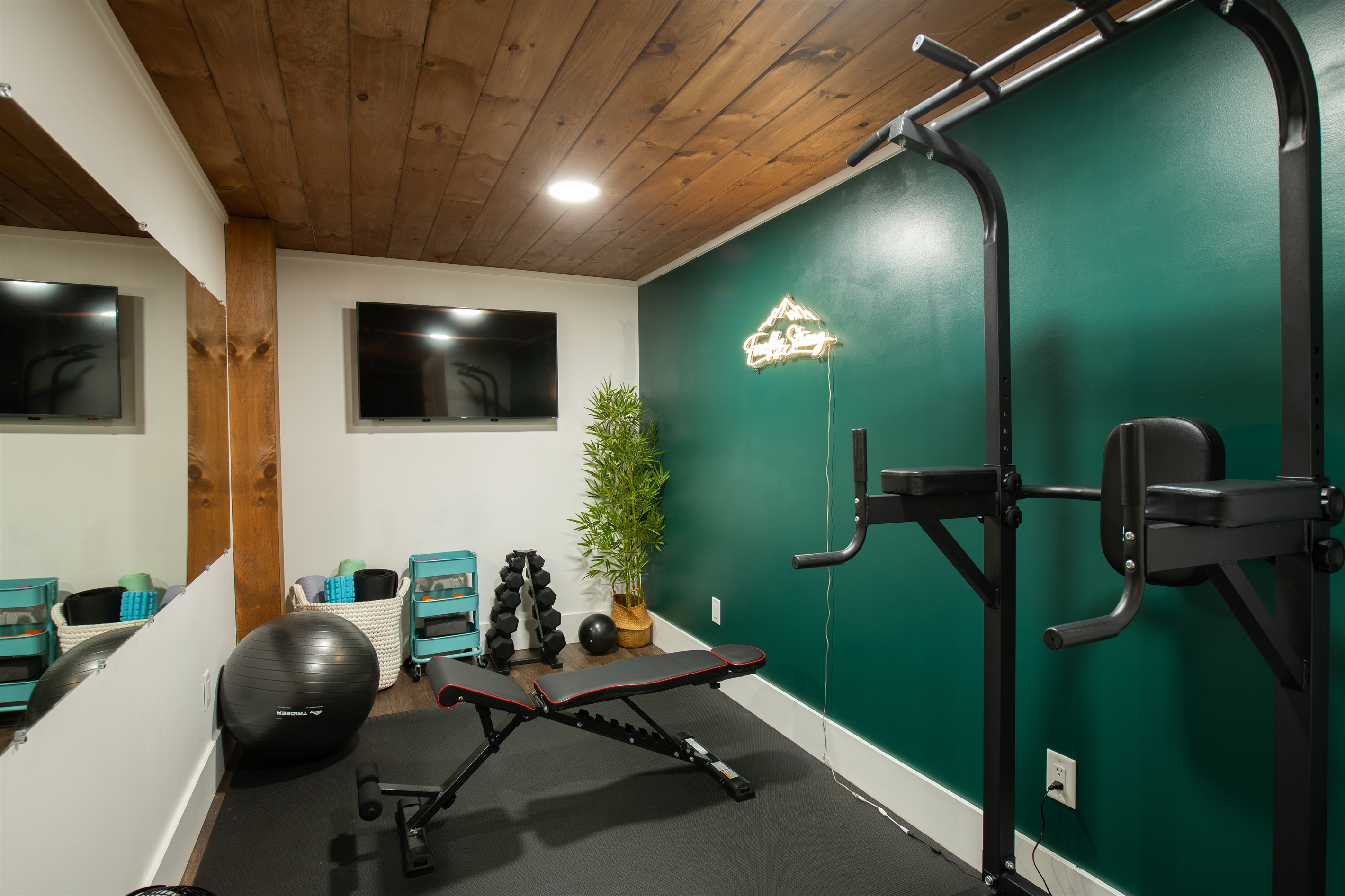 Private Gym | Fully equipped with Peloton, free weights, and strength training station