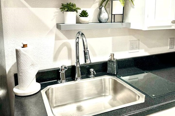 No dishwasher but you will have dish soap, drain tray, and plenty of dish towels. Paper towels 